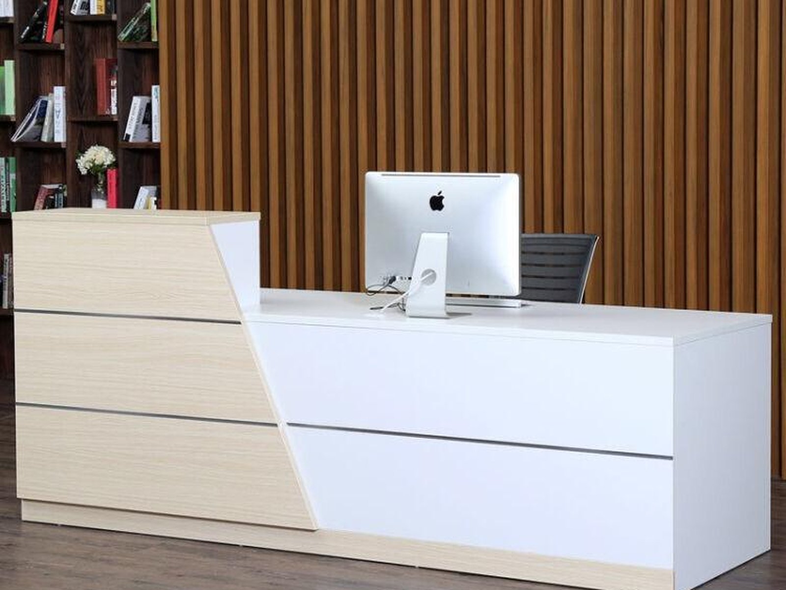 Custom reception counter with waiting seating in a corporate lobby